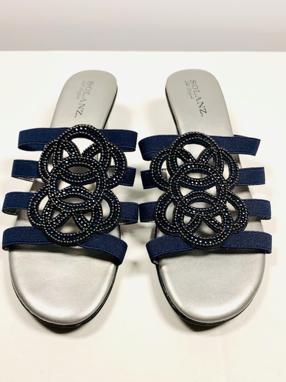 Solanz open toe slip on sandal navy blue circle rhinestone embellished low heel